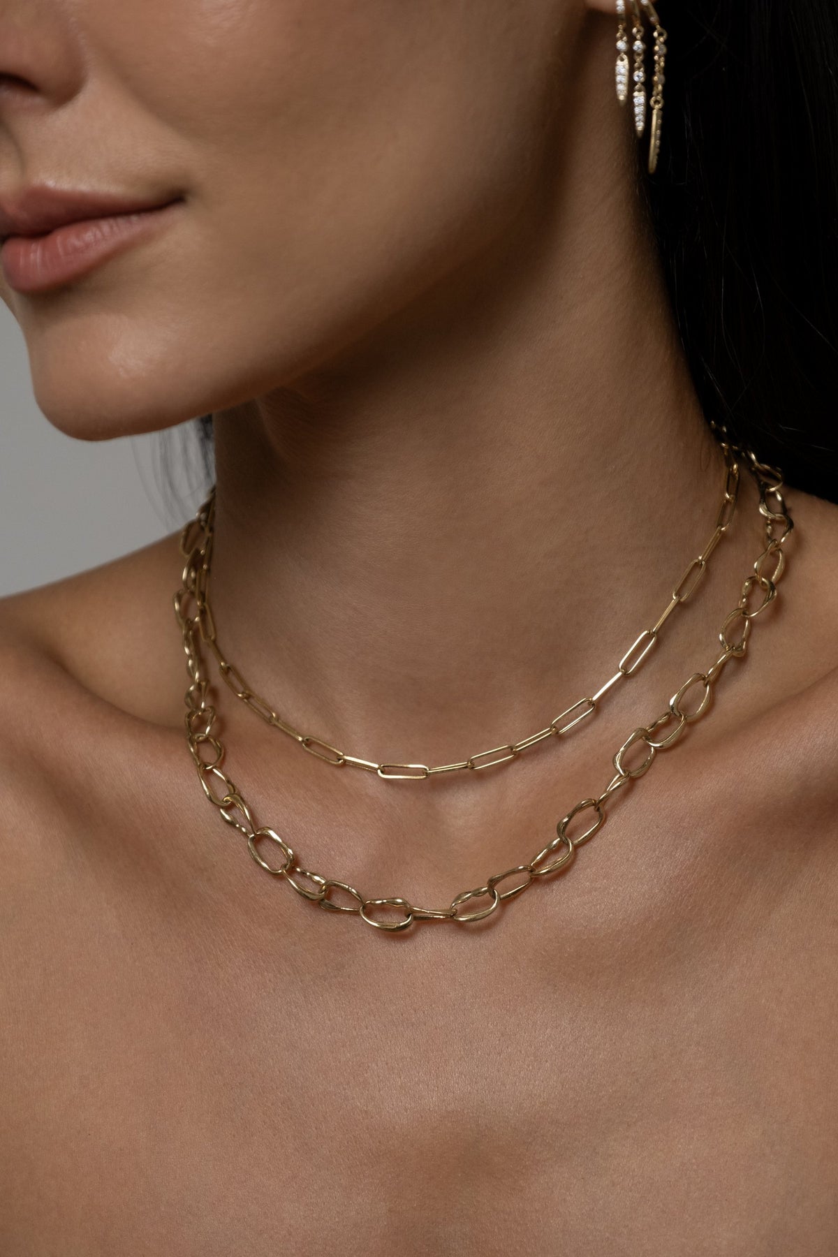 Model wearing Rio Earrings, Paperlink Chain, Mini Monaco Necklace