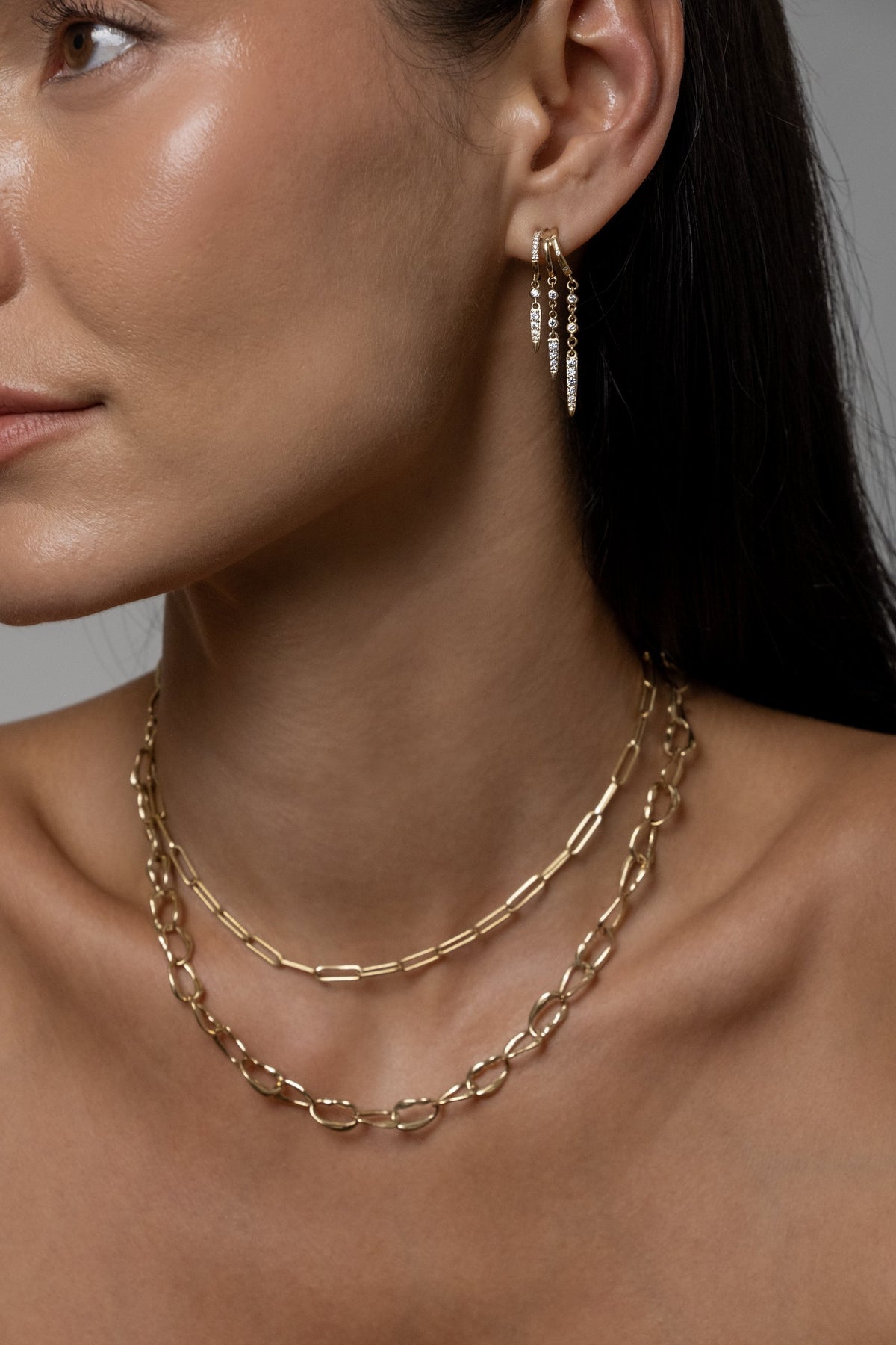 Model wearing Rio Earrings, Paperlink Chain, Mini Monaco Necklace